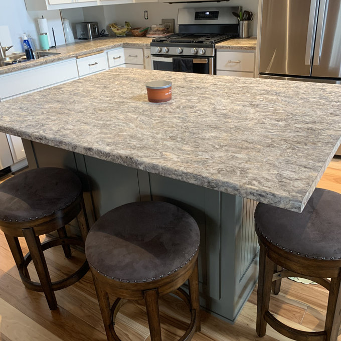 Curating warmth through contrast with an industrial swivel counter stool with back